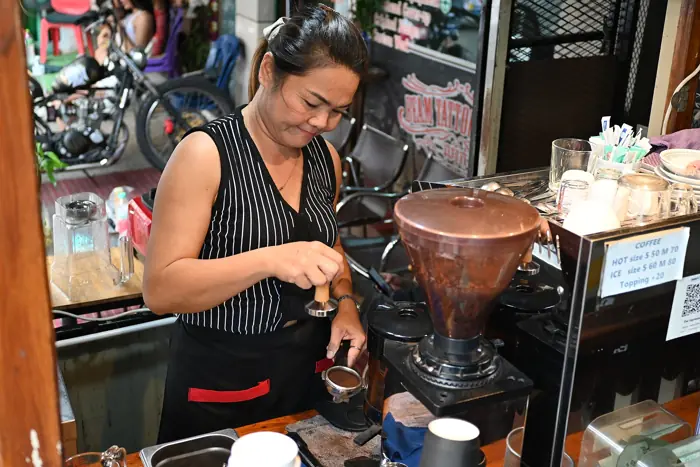 A barista making coffee