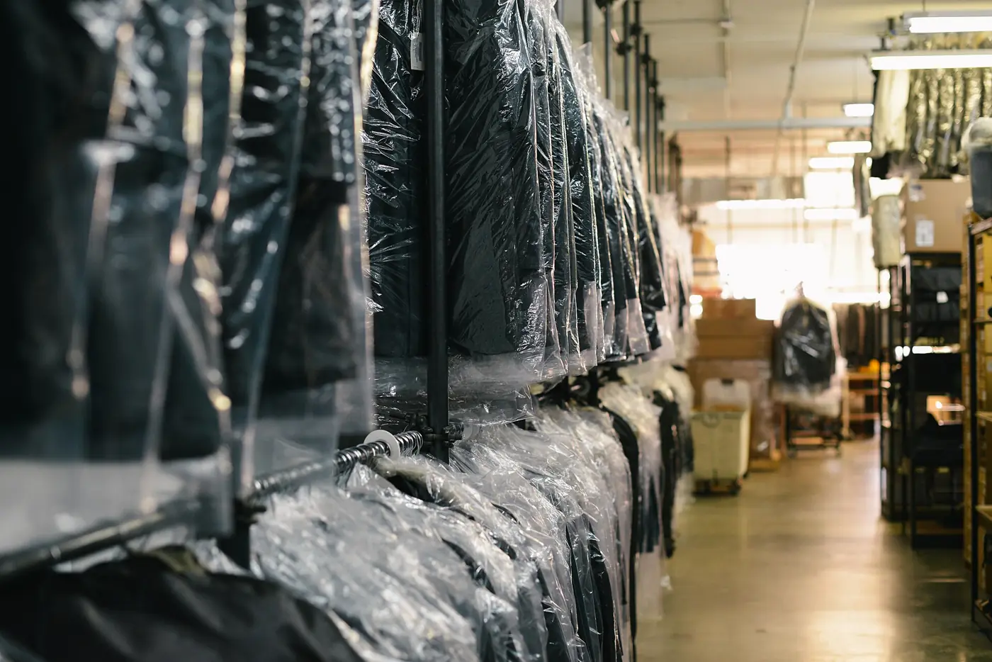 Dry-cleaned clothes on hangers